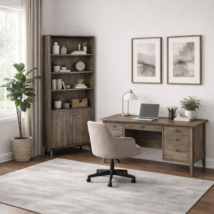 Home office with wooden desk, bookshelf, and chair.
