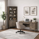 Home office with wooden desk, bookshelf, and chair.