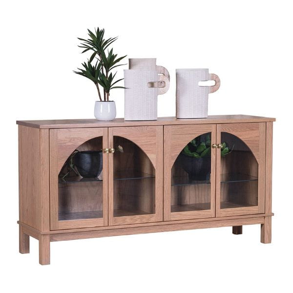 Wooden sideboard with glass doors displaying decorative items on a white background