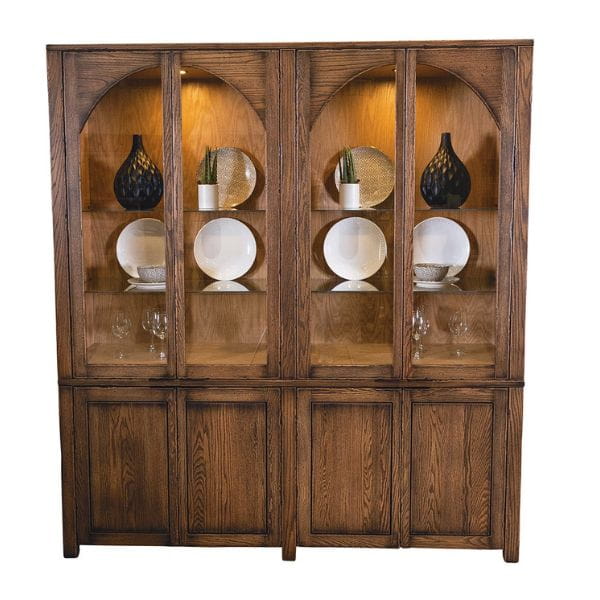 Wooden display cabinet with glass doors containing decorative items on a white background