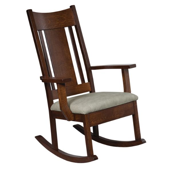 A handcrafted crescent rocking chair made of quarter sawn white oak with asbury stain, featuring an upholstered seat in alabaster color.