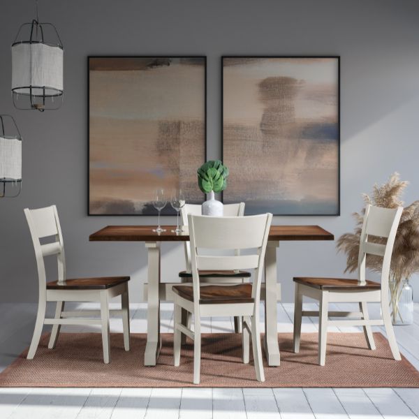 Dining room with a wooden table and chairs against a gray wall with abstract art.