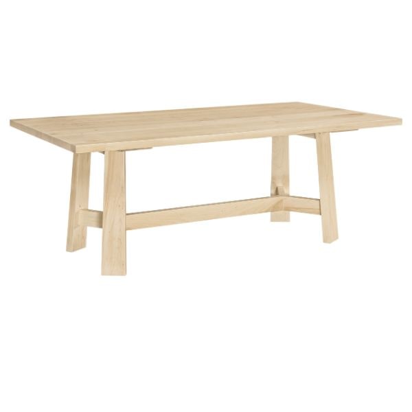 Light wooden dining table on a white background