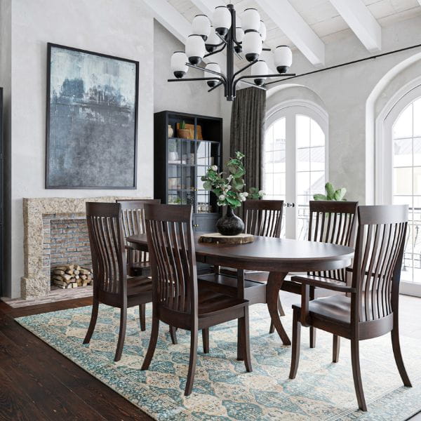 Dining room with wooden table and chairs, fireplace, and large windows.