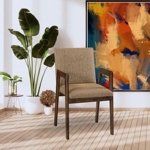 brown chair in front of a painting and light wooden floors