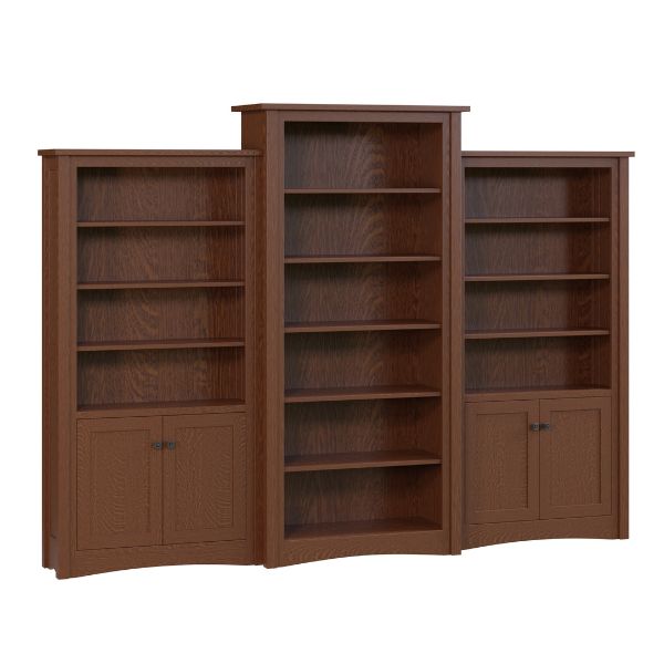 A set of three Aspen wall bookcases made of oak with the central bookcase featuring a cherry stain finish and side bookcases in a natural oak color.