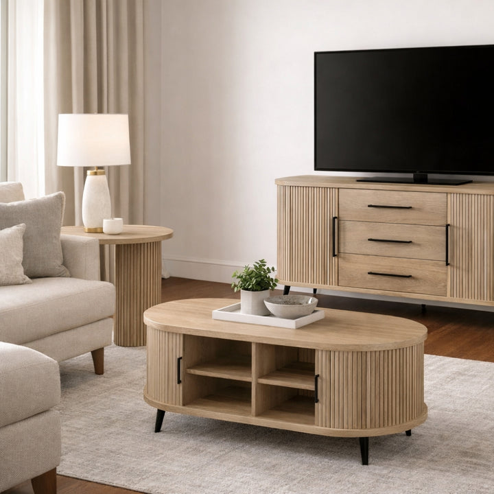 Modern living room with wooden TV stand, coffee table, and armchair.