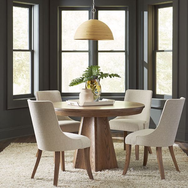 circle table with 4 white chairs