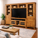 Wooden entertainment center with TV and shelves in a living room setting.