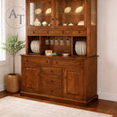 Wooden hutch with glass doors and shelves in a room setting.