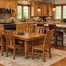 Wooden dining table with chairs in a kitchen setting