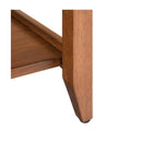 bottom leg of brown table 