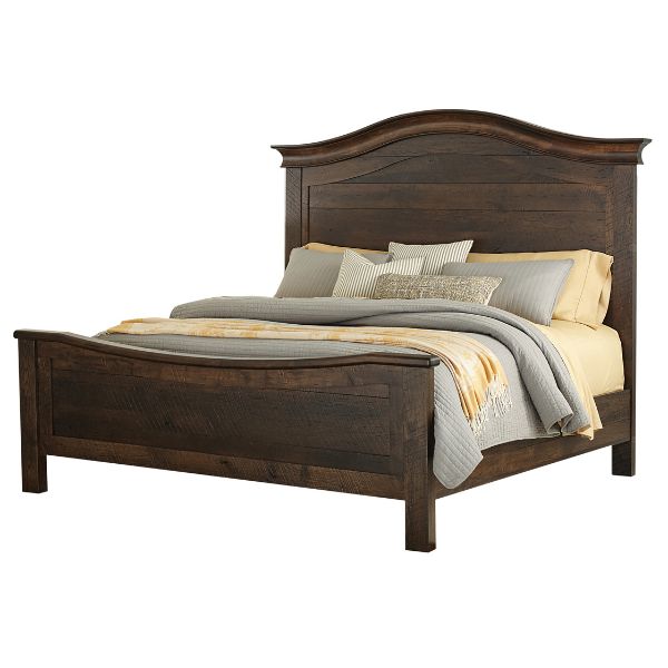 A brown wooden farmhouse bed with a high headboard and footboard, made in the USA, shown with bedding and pillows.