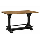 Table with wooden top and black metal legs on a white background