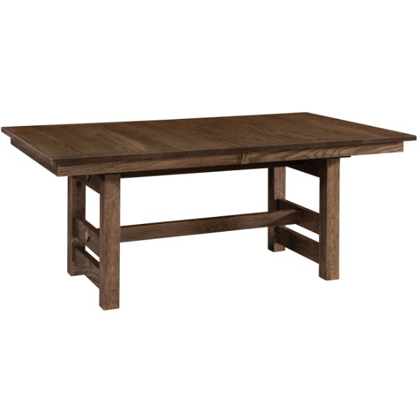 A rectangular trestle extension table with a mission edge top in a brown finish, supported by four trestle legs.