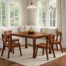 Wooden dining table with chairs in a bright living room setting