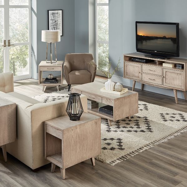 A set of Marina occasional furniture in a living room setting, including a sofa table, end tables, and a coffee table with wood finishes.