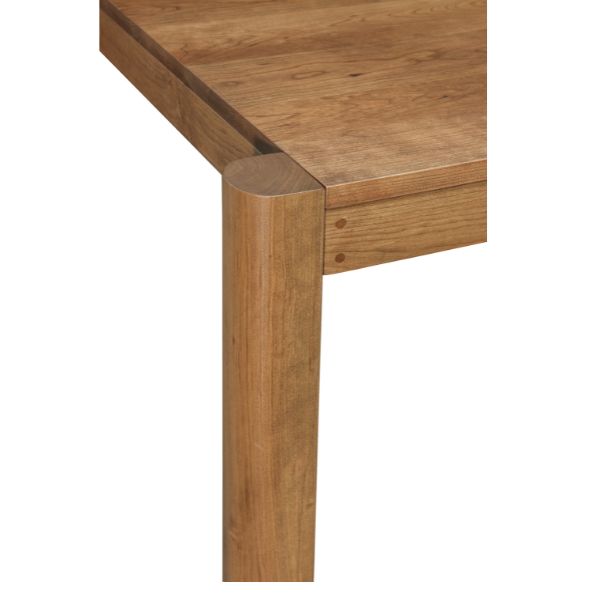 Close-up of a wooden table corner on a white background