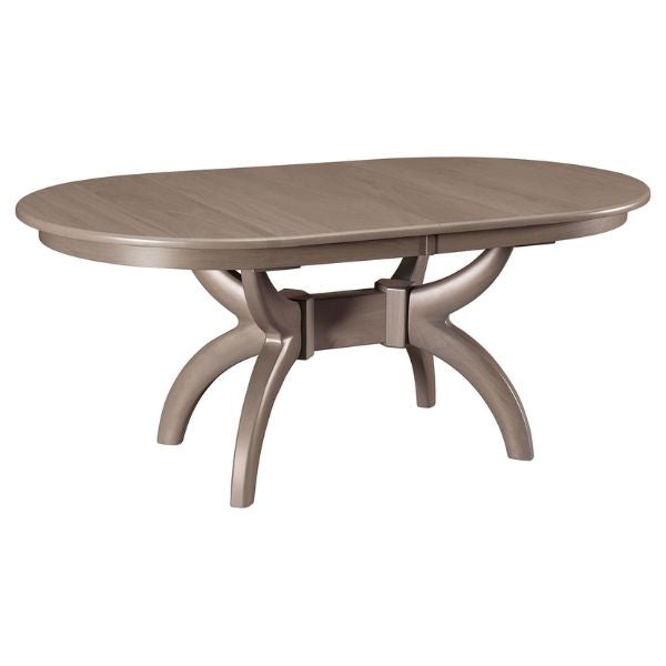 Oval-shaped double pedestal dining table in a gray finish with a curved base, shown without any leaves extended.