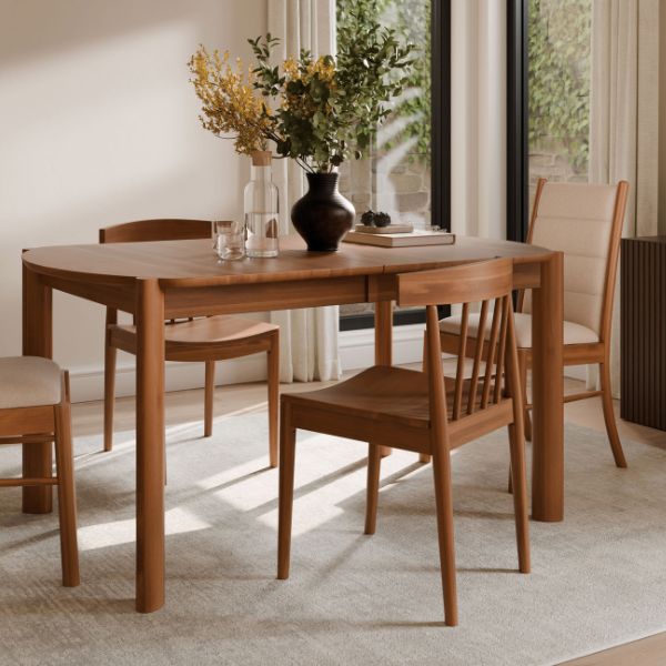 brown wooden dining room table with 4 chairs, under a white carpet