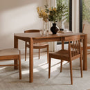 brown dining room table in the dining room, with 4 seats around. 