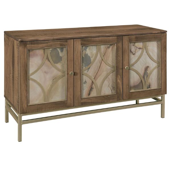 A contemporary sideboard with a brown maple wood front and a metal base featuring a geometric pattern of gold metal inserts.