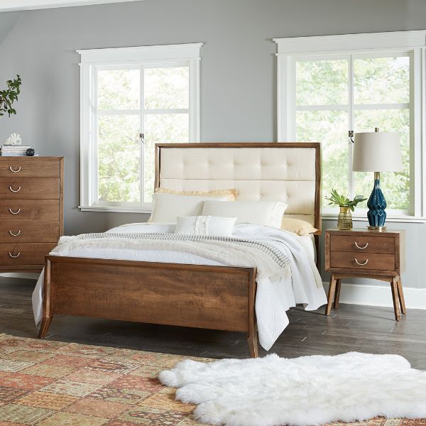 dark wood bedroom furniture with a white cushion  