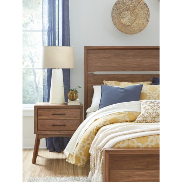 yellow bedding with blue pillows and dark wood bedroom furniture
