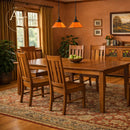 Dining room with wooden table and chairs, Amish furniture branding visible.