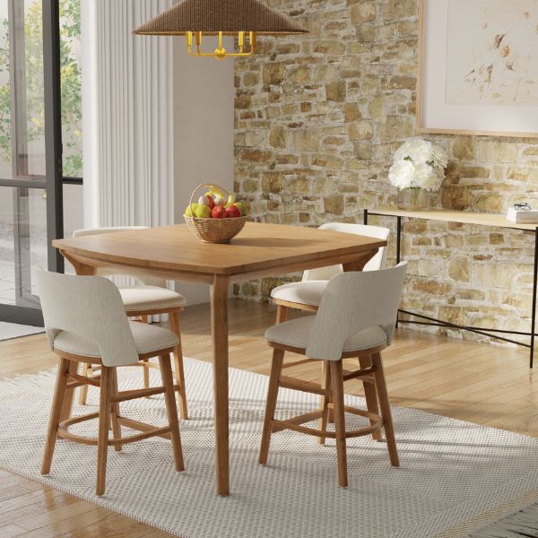 Dining area with wooden table and chairs against a stone wall.