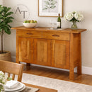 Wooden sideboard in a dining room with decor items on top