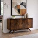 Wooden sideboard in a room with a geometric abstract painting on the wall.
