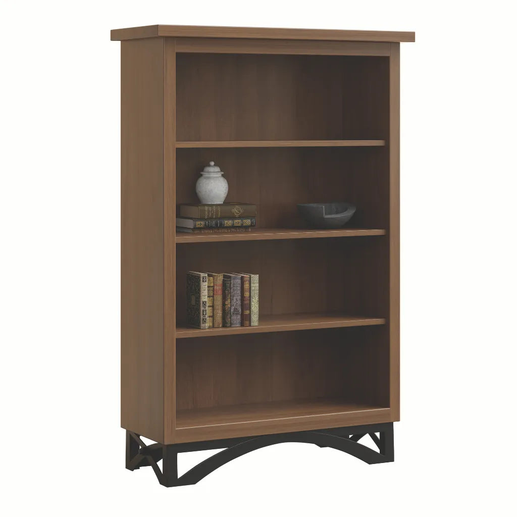 A three-tier wooden bookcase with a medium brown finish and black metal support feet, shown on a plain white background with decorative books and vases on the shelves.