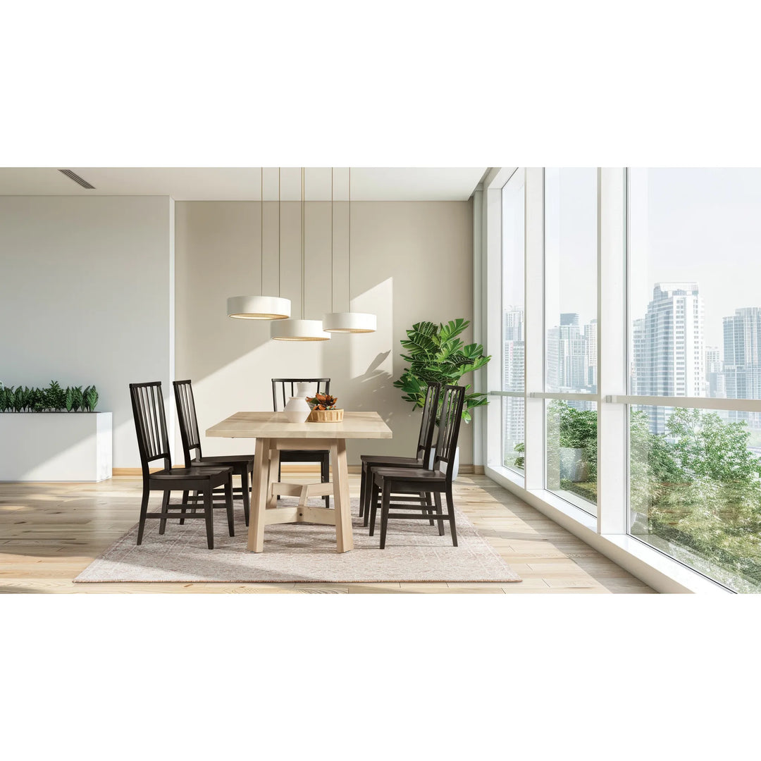 A modern dining room setup featuring a rectangular light wood dining table surrounded by six dark brown wooden chairs, set on a light beige rug under three white pendant lights, with a large window showing a city skyline in the background.
