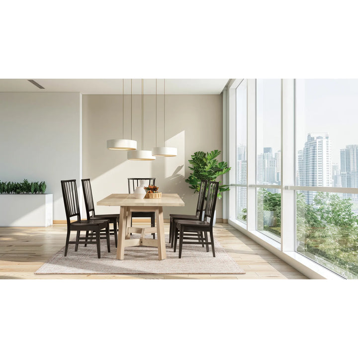 A modern dining room setup featuring a rectangular light wood dining table surrounded by six dark brown wooden chairs, set on a light beige rug under three white pendant lights, with a large window showing a city skyline in the background.