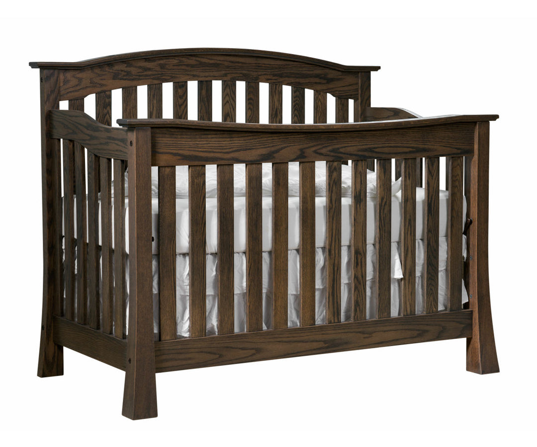 A dark knight brown wooden crib with a white mattress, constructed from solid hardwood with mortise & tenon joints and decorative bronze connector bolts.