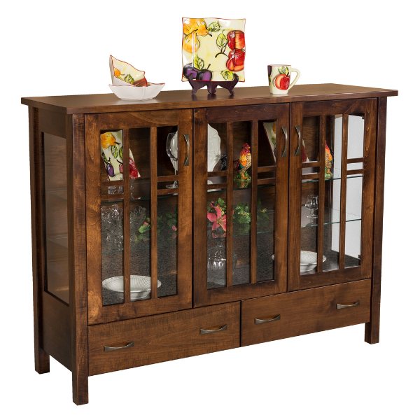 A wooden sideboard with overlay doors, plain wood back, and glass panels with plate groove hardware. It is displayed in a room setting with decorative items on top.