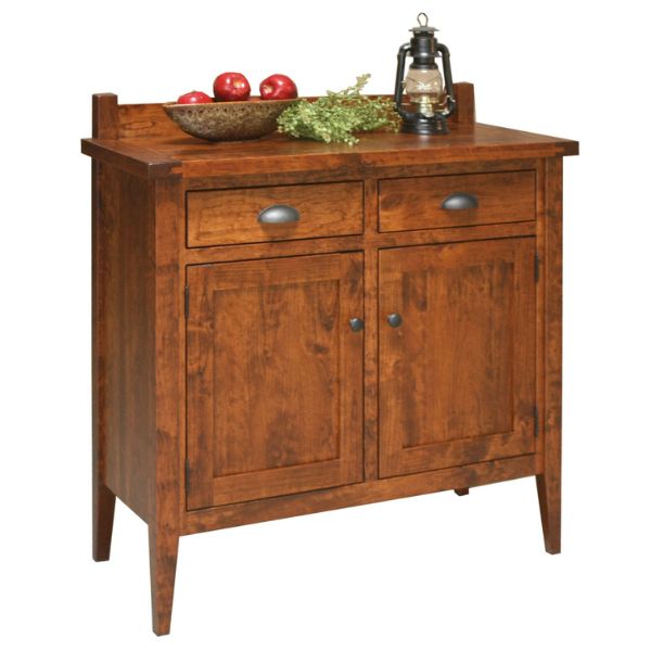 A Jacoby sideboard made of solid hardwood with a plate rack on top, featuring multiple storage drawers and doors, displayed in a rustic cherry finish.